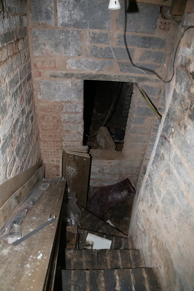 At first glance it seemed to run under the whole building. Time to get some help.