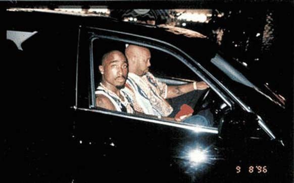 Tupac Shakur sits with his manager Suge Knight before he was shot to death in a drive-by on September 13, 1996.